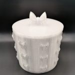 White 3D printed bow storage tub with matching lid, featuring raised bow details around the sides and a decorative bow handle. Perfect for storing jewellery, trinkets, keepsakes and small accessories.