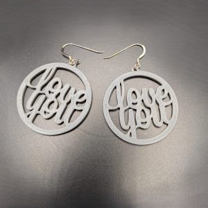 White Love You statement earrings with elegant script lettering and silver hooks