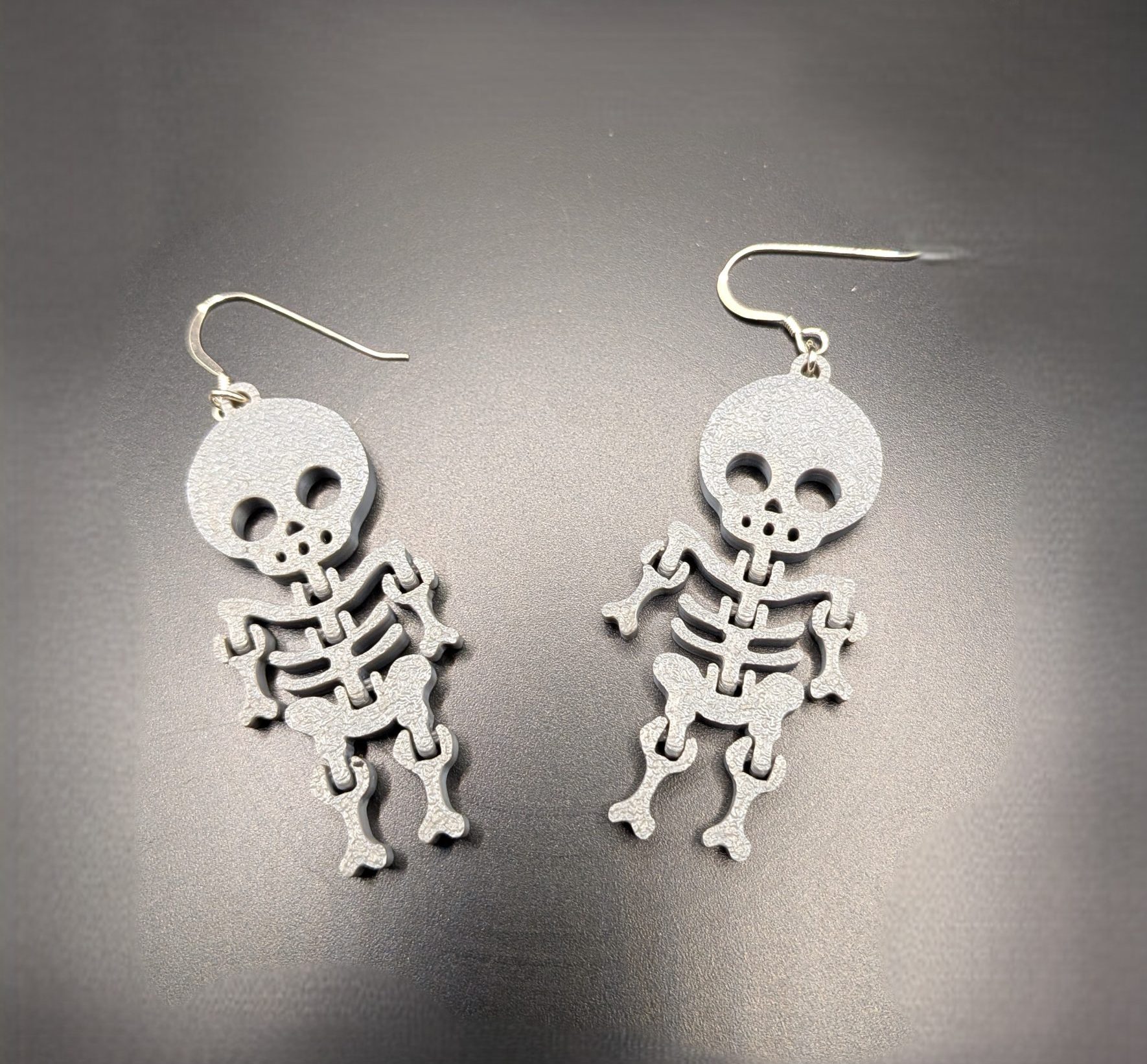 Skeleton Earrings Bitsy Boutique Grey skeleton drop earrings with silver hooks, lightweight gothic jewellery perfect for Halloween and alternative fashion.